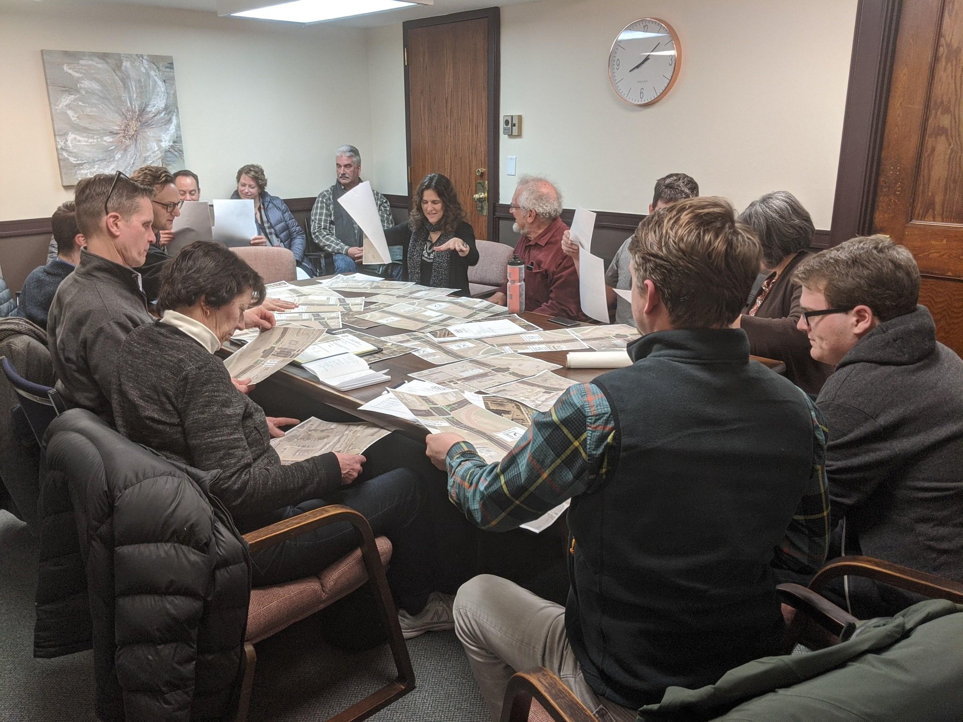 A group of members at one of our monthly meetings, discussing ideas for street layout designs.